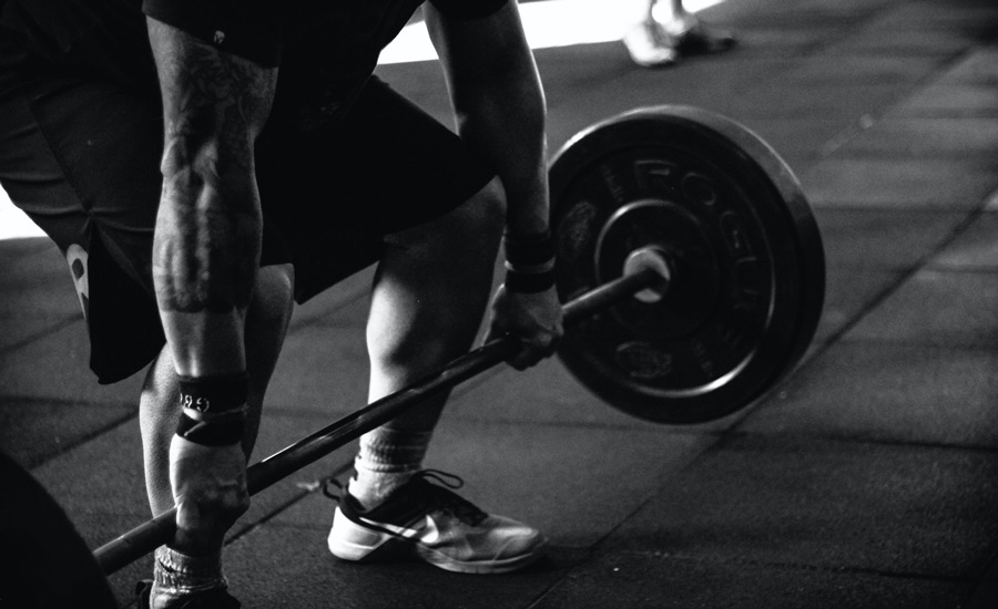 Muscular Man Lifting Weights